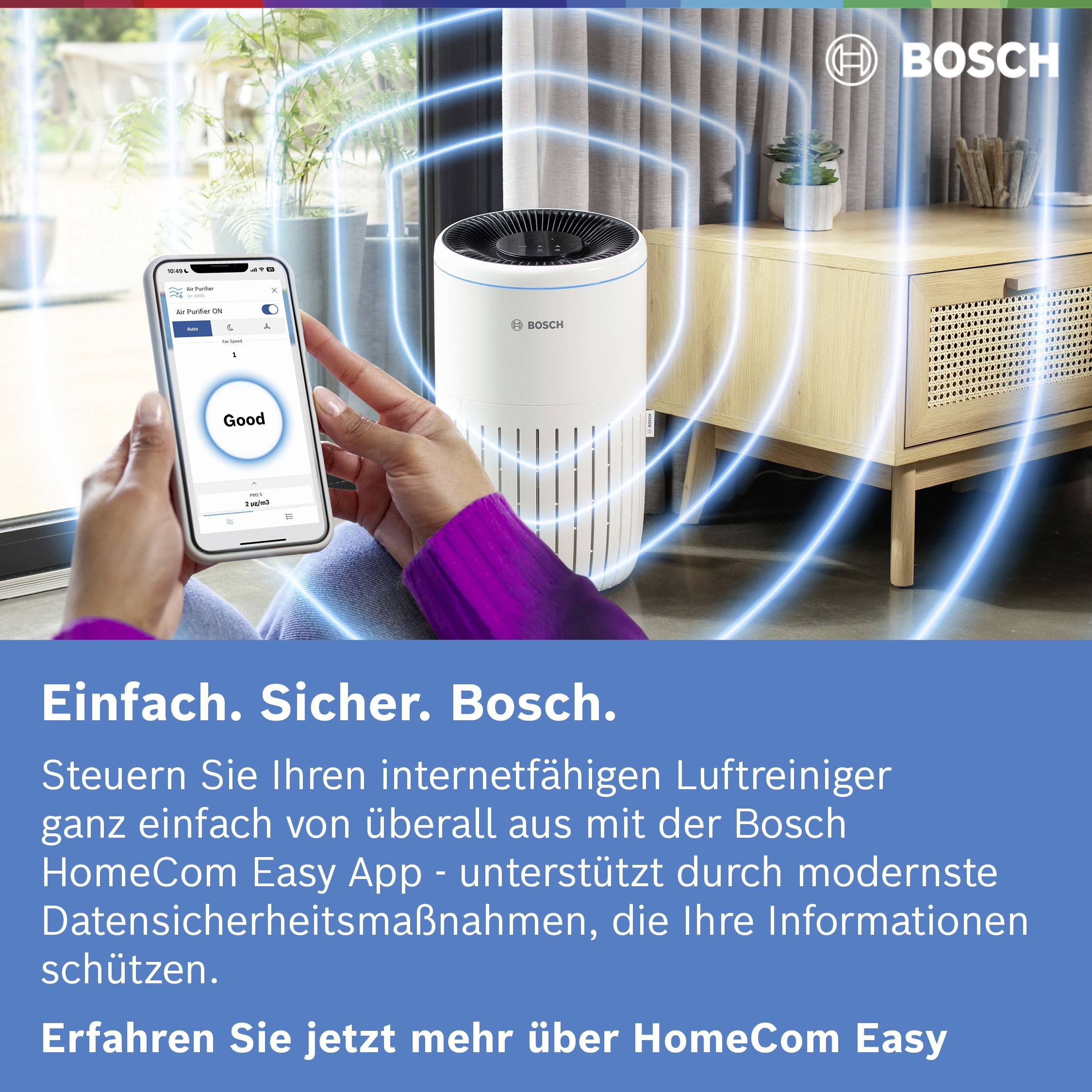 Woman controls an air purifier via smartphone app. Text: 'Simple. Safe. Internet-enabled. Find out more about HomeCom Easy now.'