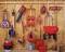 Tools in a shed: Spades, leaf blower, ladder, hosepipe, wheelbarrow, watering can and jerry can neatly hung on the wall.