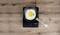 A fried egg in a pan on an activated induction hob. The digital display shows '1400'.