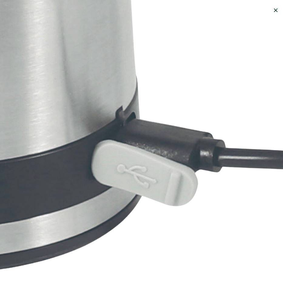 Close-up of a USB port on a silver device, connected with a black cable.