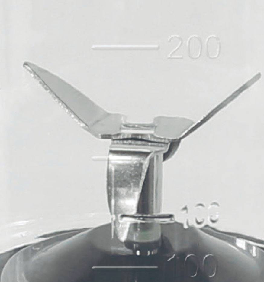 A mixer blade in a container with markings for 100 and 200 millilitres.