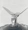 A mixer blade in a container with markings for 100 and 200 millilitres.