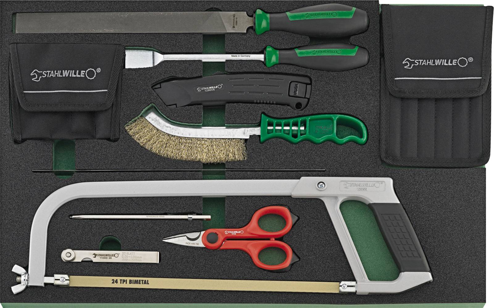 Tool set comprising a metal saw, files, a wire brush, a craft knife, screwdrivers and scissors in a foam insert.