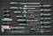 A toolkit containing various screwdrivers and measuring tools, neatly arranged in a case. Items are green and black.
