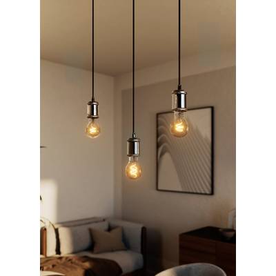 Three hanging light bulbs illuminate a modern living room with wooden furniture and an abstract artwork on the wall.