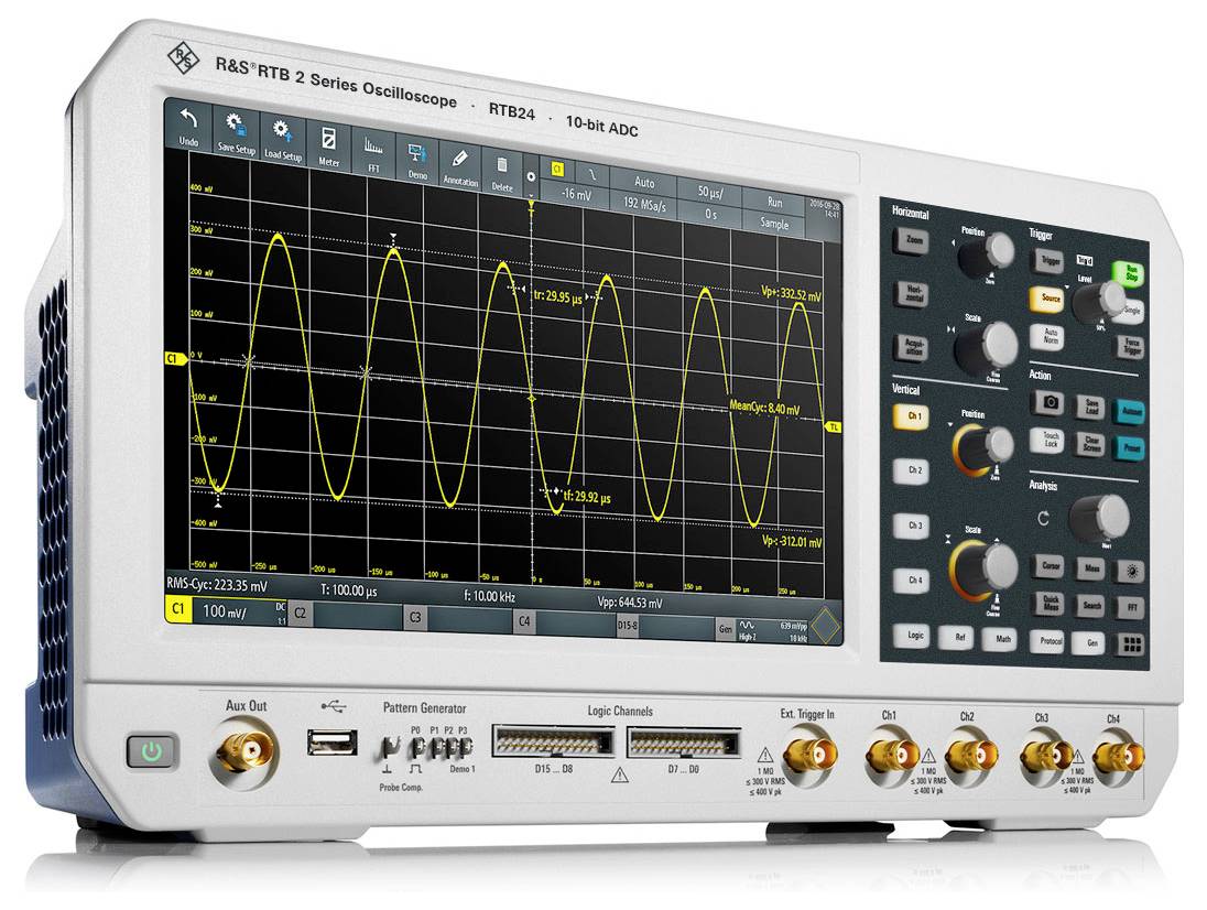 A digital oscilloscope displays yellow sinusoidal waves on a black screen. Control buttons and connectors are visible.