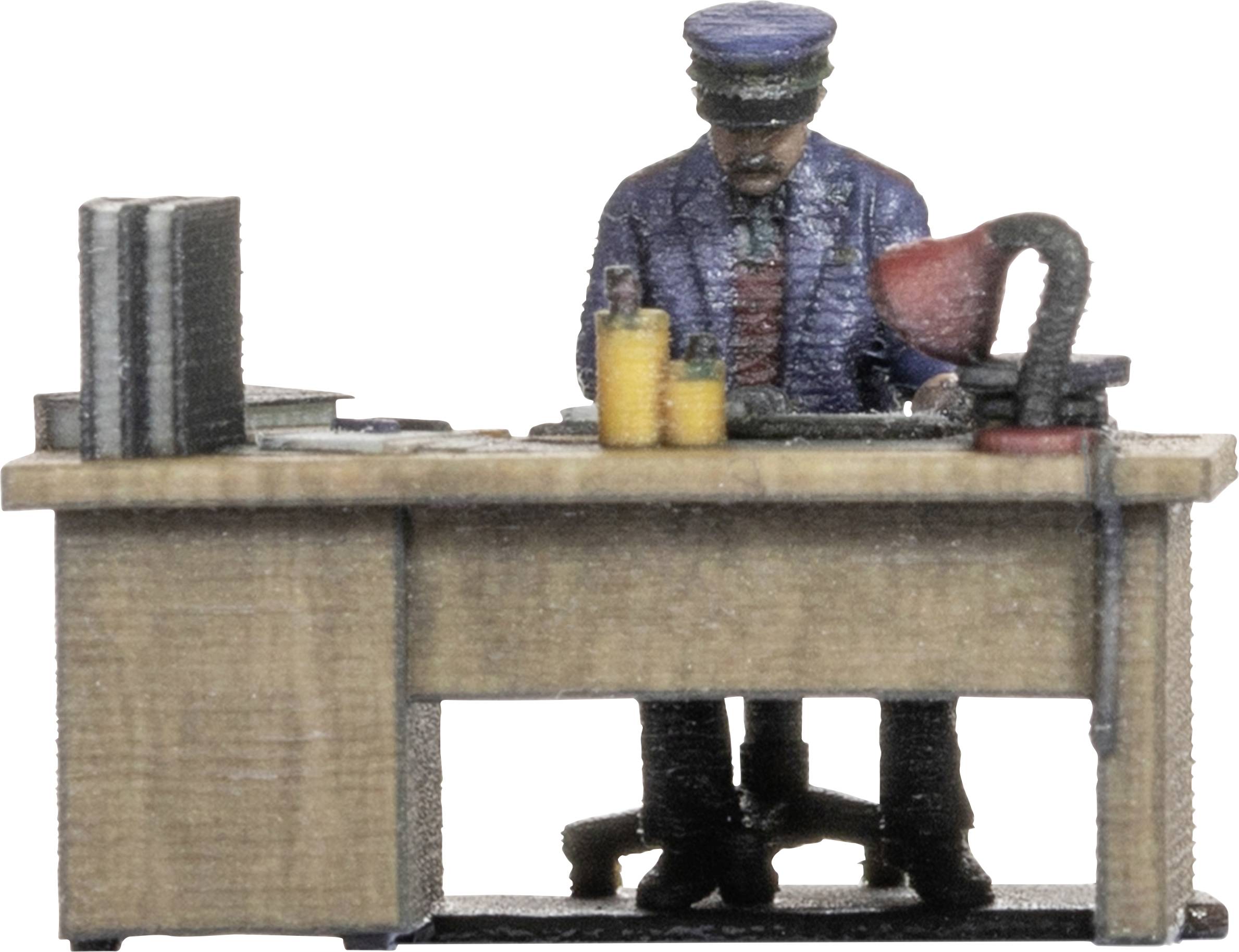 A miniature figure in uniform is working at a desk with books, folders, and a lamp.