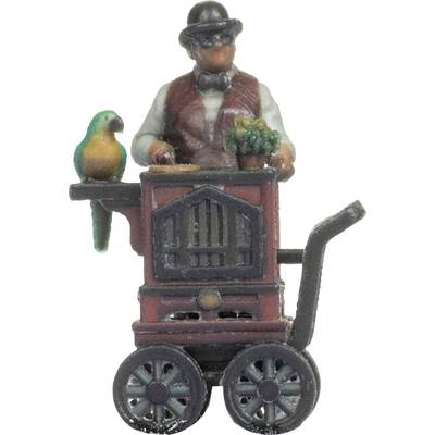 A man in traditional clothing operates a barrel organ, with a colourful parrot perched on top.