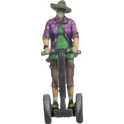 A figure wearing a sun hat and colourful clothing rides a Segway, dressed like a tourist.