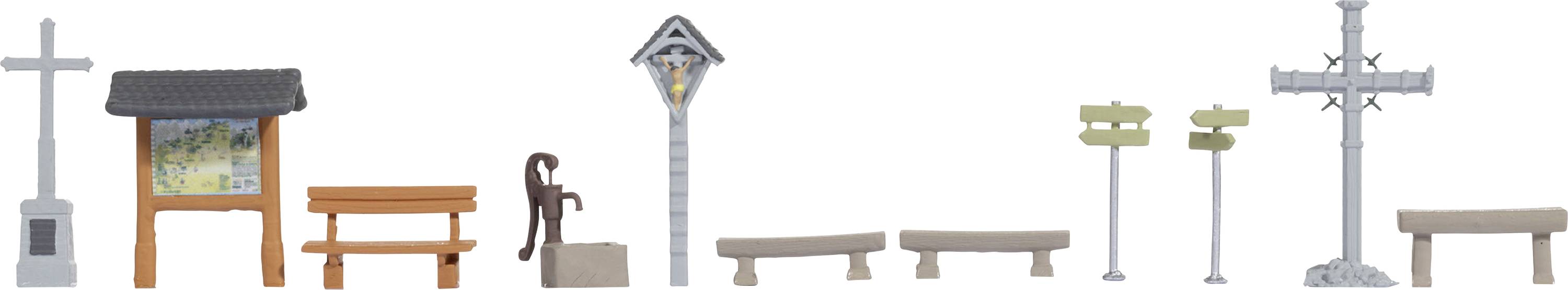 Small models of park and street furniture, including a bench, a signpost, and a street lamp, lined up against a white background.