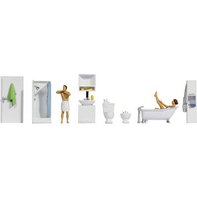 Miniature bathroom scene with shower, man in towel, sink, toilet, and woman in bathtub.