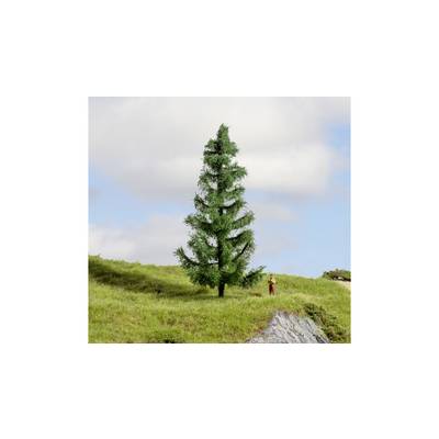 A single fir tree stands on a grassy hill beneath a cloudy sky. A small figure stands beside it.