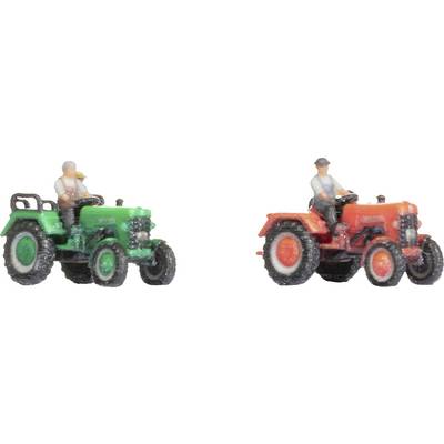Two toy tractors with drivers: One in green, one in red. Both drivers are wearing grey clothing and are seated on the tractors.