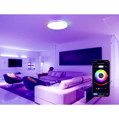 A modern living room with colored ambient lighting. A smartphone screen displays a lighting control app, indicating smart home technology.