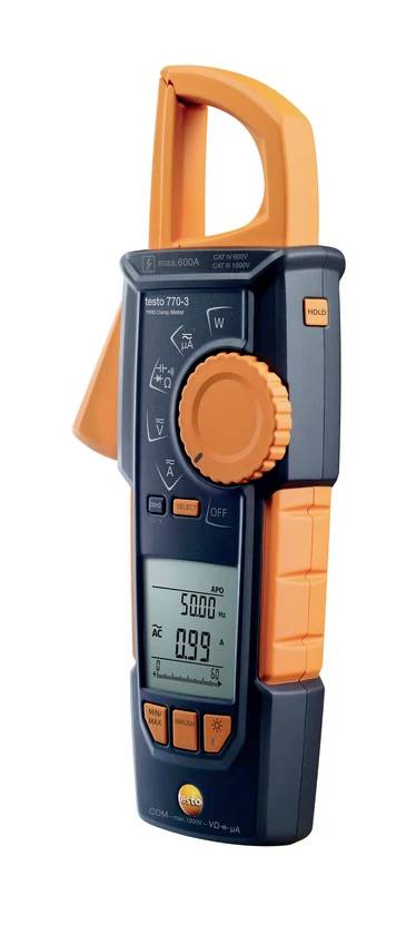 A digital electricity meter with display showing current measurement values. It has an orange-black surface with a rotary dial and buttons.