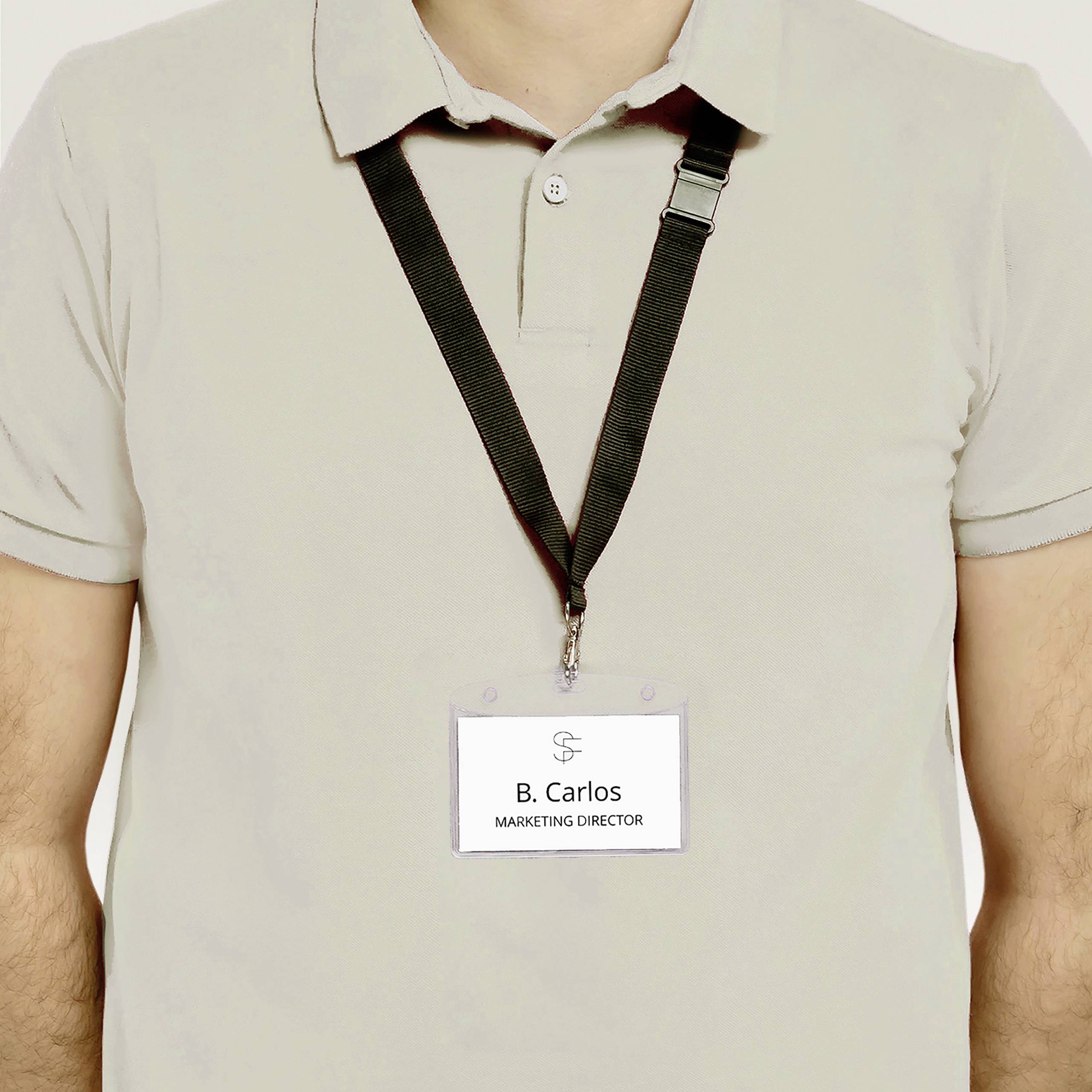 Person in a grey shirt wearing a name badge. Name badge displays the name 'B. Carlos' and job title 'Marketing Director'.