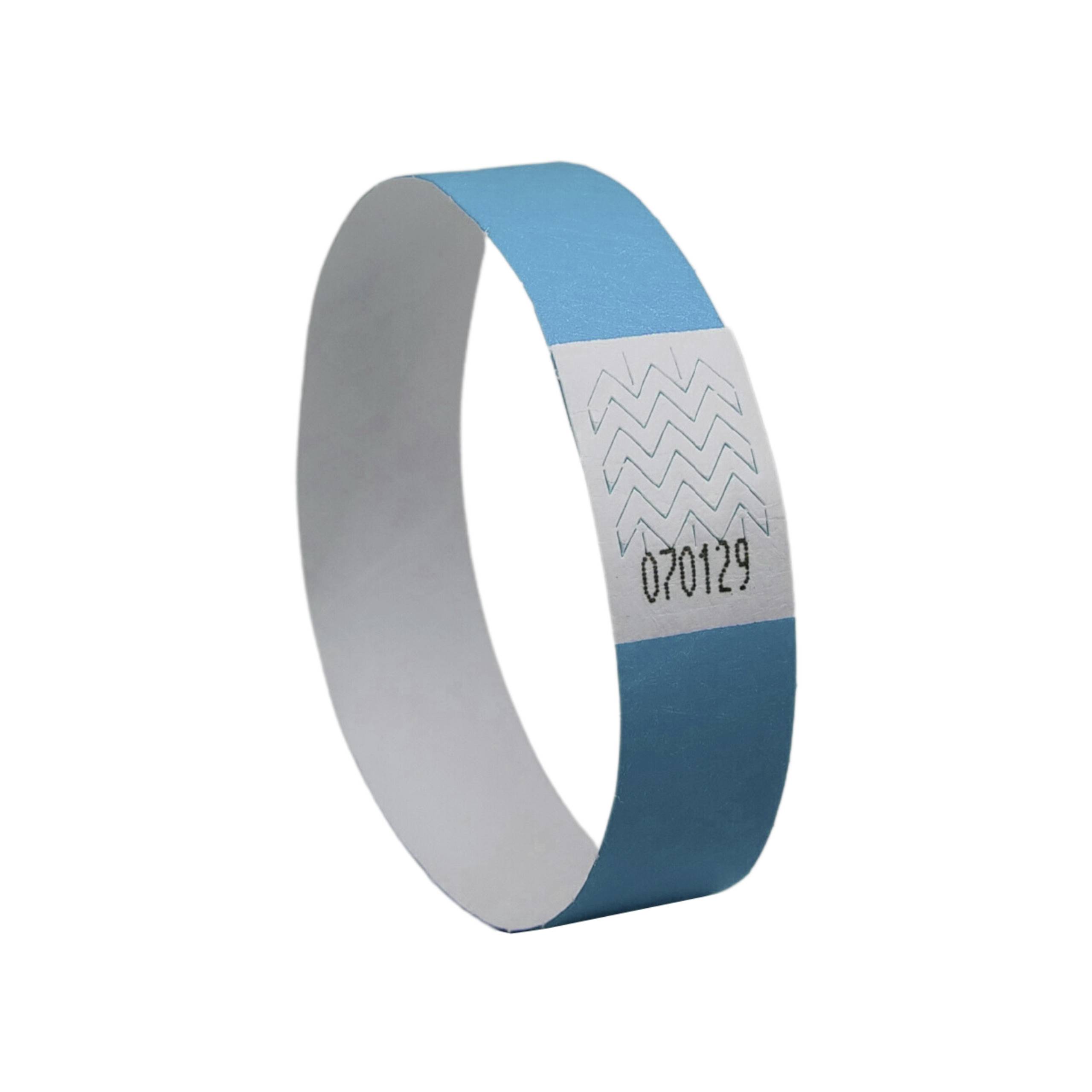 Blue and white entry wristband with a zigzag pattern and number '070129'.