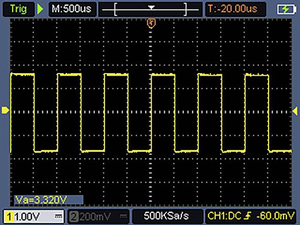 An oscilloscope screen displays a yellow square wave signal with a period of 500 microseconds and amplitude of approximately 3.32 volts.