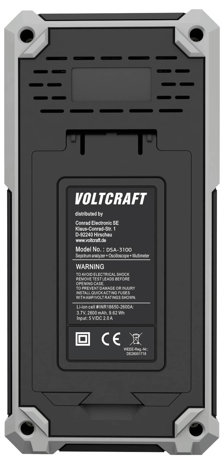 A digital device with a label reading 'Voltcraft', model number 063A-310D, featuring technical specifications and a warning about electric shock.