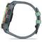 A side view of a robust smartwatch with green and orange casing and strap, suitable for outdoor activities.