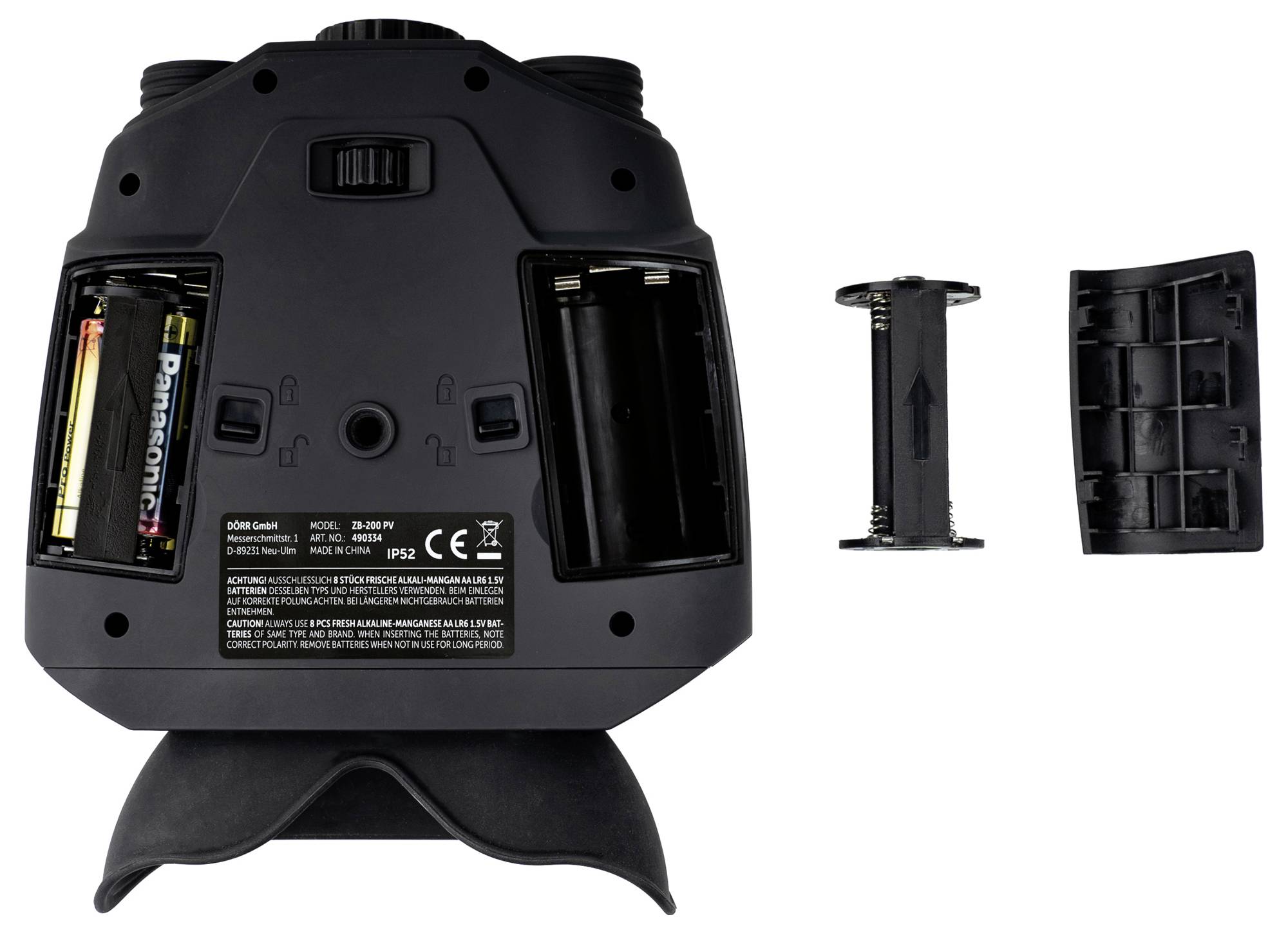 'Underside of a device with battery compartments open; two AA batteries on the left side, empty compartment on the right side.'