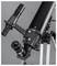 A black telescope with multiple eyepieces on a tripod, ready for sky observation.