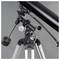 A black telescope on a tripod with multiple adjustment mechanisms, suitable for astronomical observations.