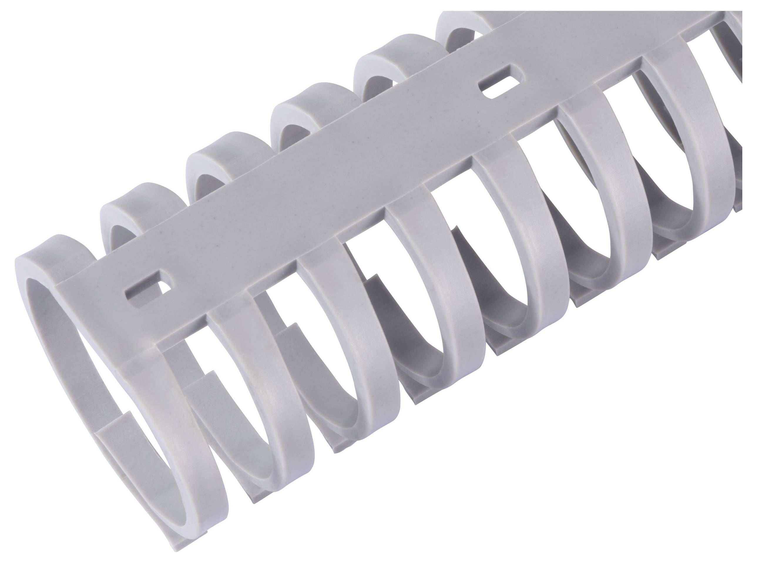 Grey plastic cable trunking with multiple openings for cable routing. Office and electronic accessory.