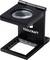 A black foldable measuring magnifier with the 'TOOLCRAFT' logo on its stand, designed for precision inspection tasks.