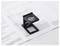 A magnifying glass rests on paper documents, assisting with the reading of small text and details.