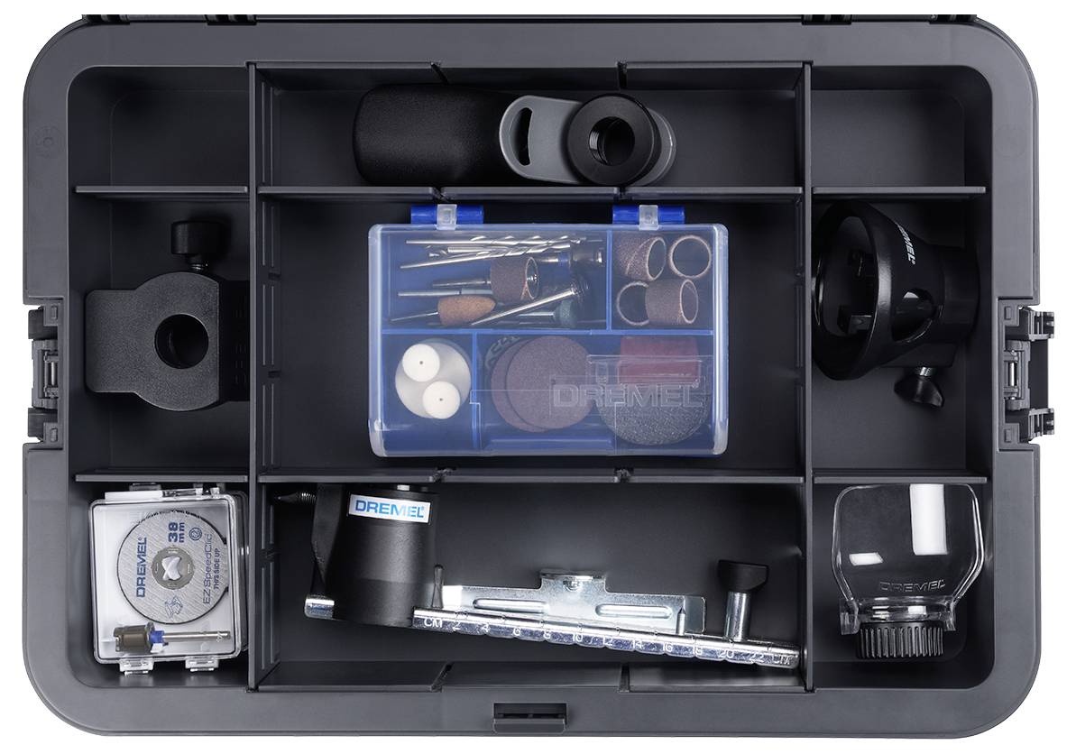 An open tool case displays various Dremel tool attachments and accessories, neatly organised in compartments.
