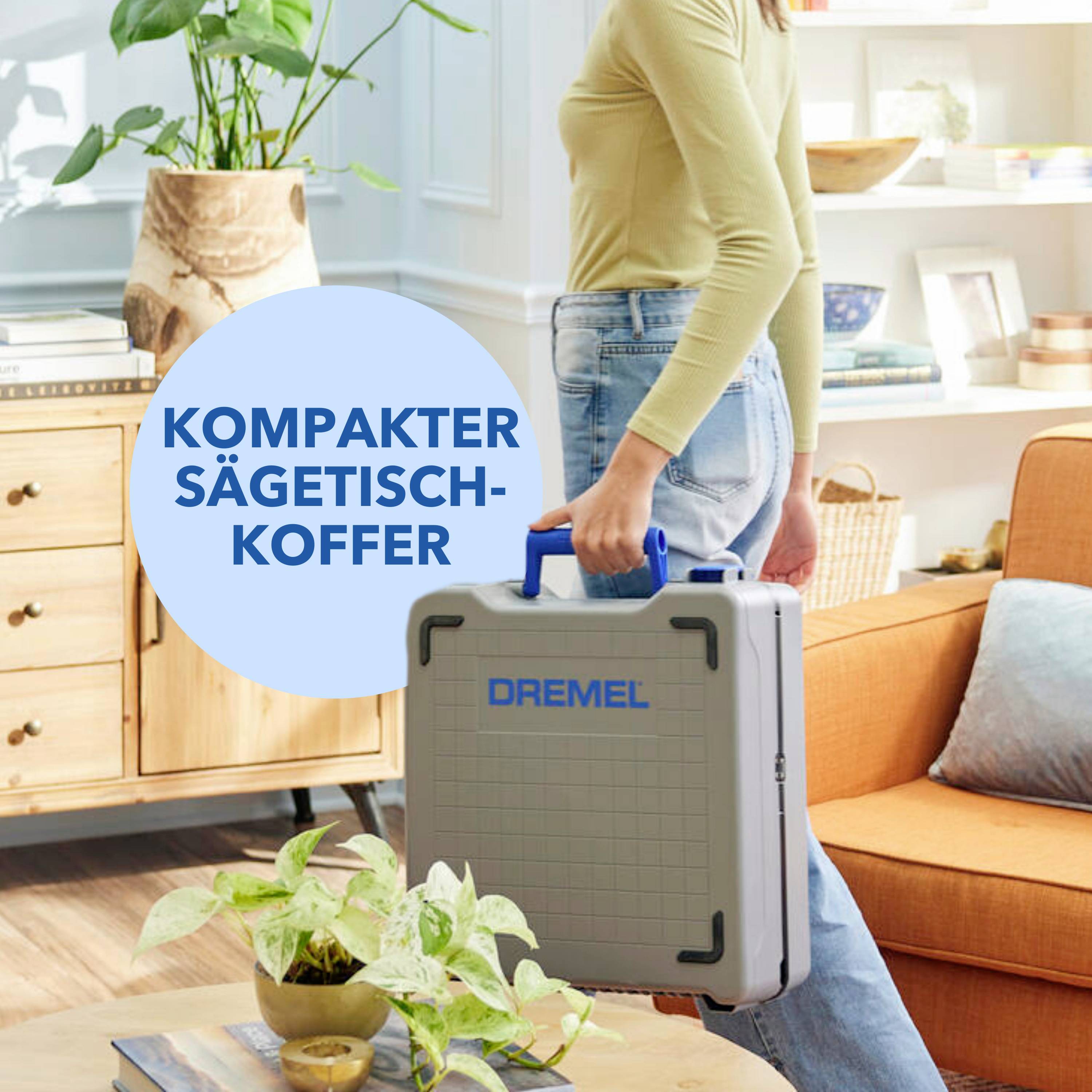 A person is standing in a living room holding a grey Dremel saw case. Text in speech bubble: 'Compact saw case'.