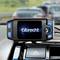 An Albrecht CB radio in a vehicle, installed in the centre console, in front of a blurred motorway scene with cars.