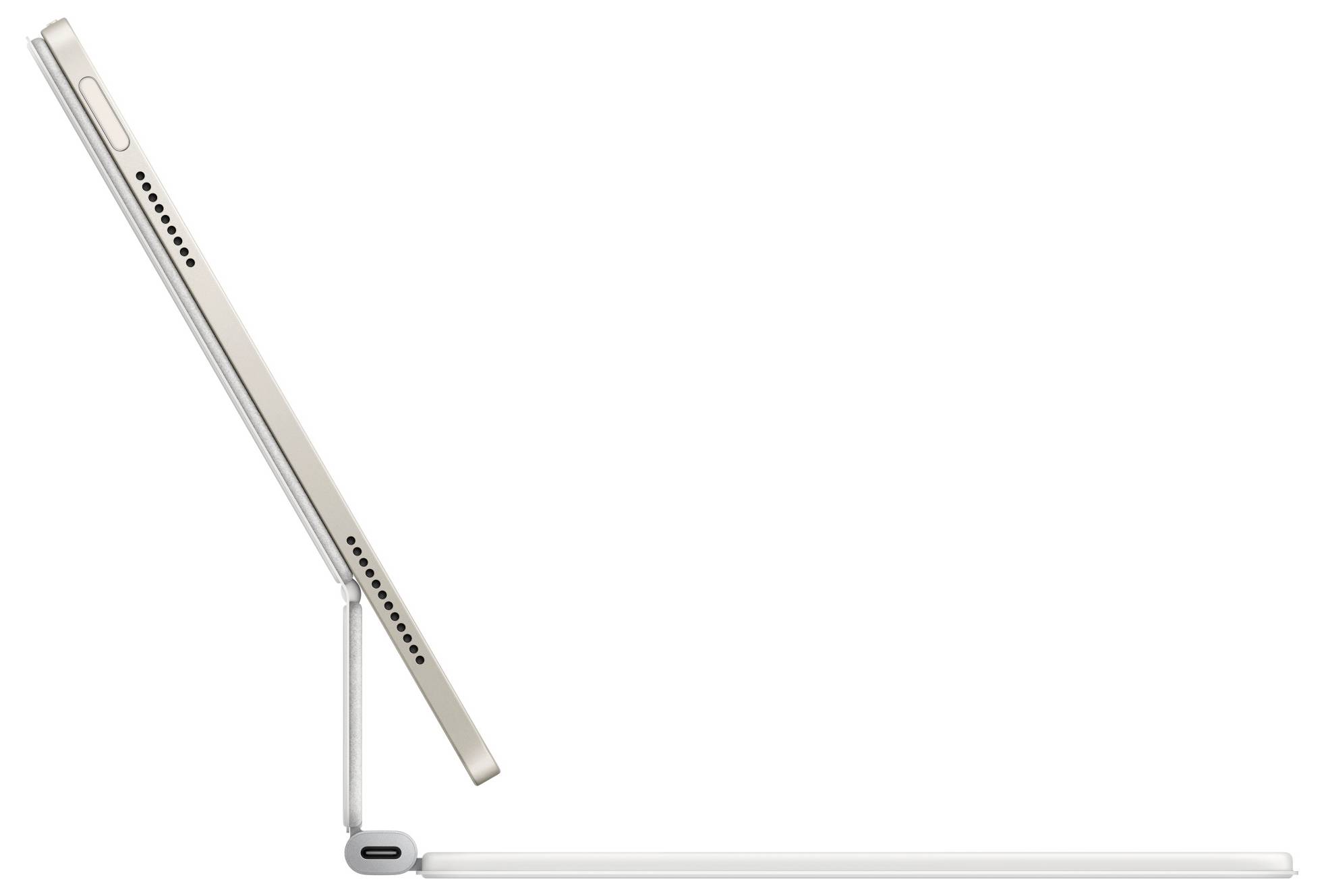 Tablet viewed from the side in a magnetic stand with keyboard. The device is visible in profile and slightly tilted.