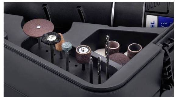 Dremel tool attachments in a case. Various attachment types, including grinding and drilling accessories, are visible.