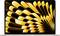 Laptop with a psychedelic yellow and black pattern on the screen, which unfolds outwards.