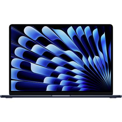 A laptop screen displays a blue-black, abstract wave pattern.