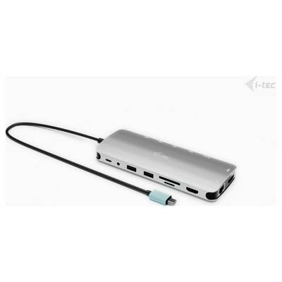 A silver USB-C hub with multiple ports, including HDMI, USB-A, SD card slot, and Ethernet, is lying on a white surface.