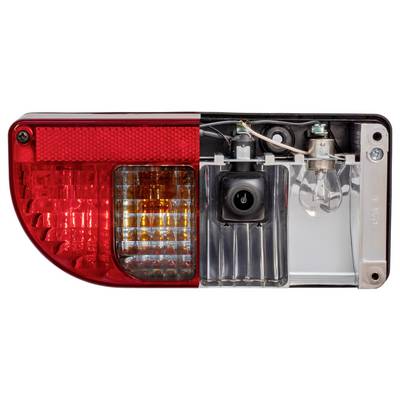 Rear light of a vehicle, showing the outer red lens on the left with orange and clear sections, and the internal wiring and bulb on the right.