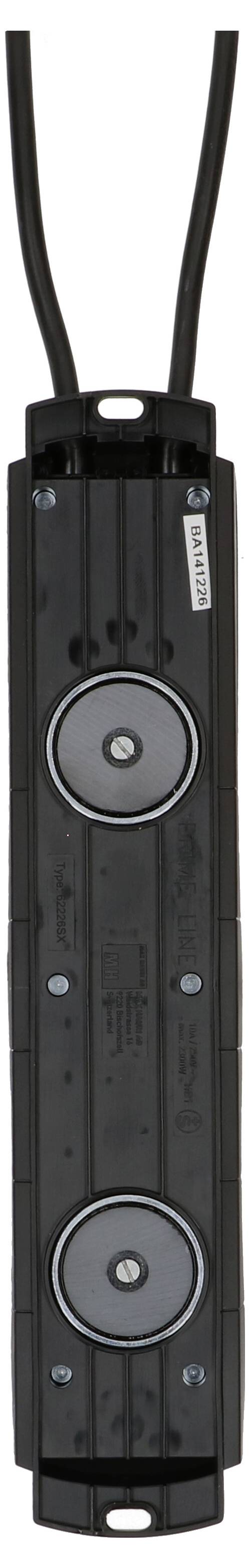 A rectangular, black cable component with two circular metal buttons in the centre, with labels printed on them.