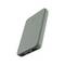 A grey power bank with two USB ports and an LED indicator on the front.