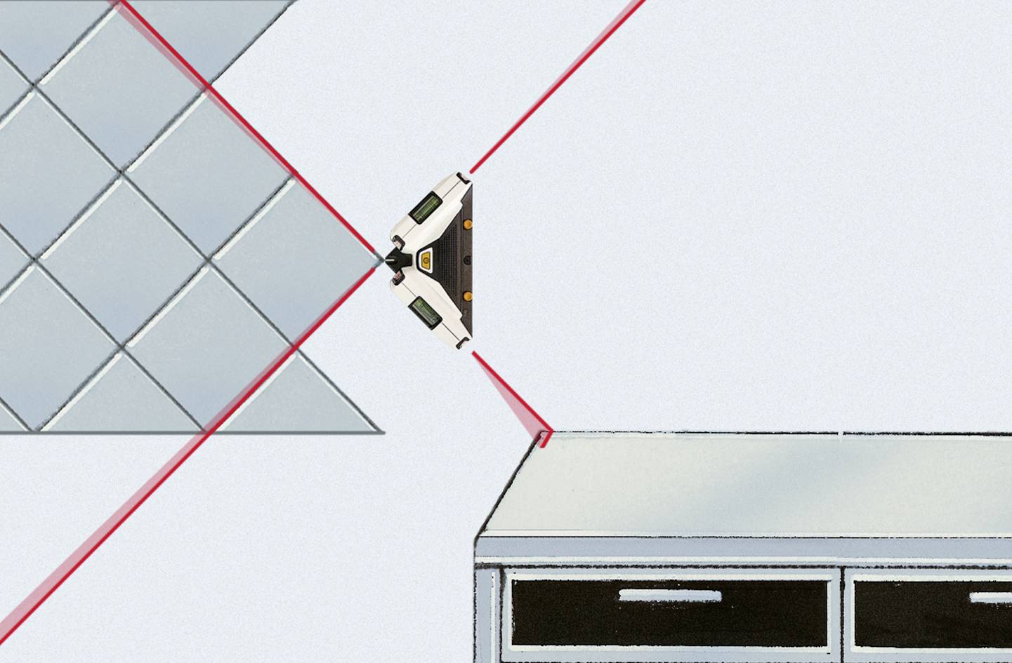 A laser level projects red lines for precise alignment of floor tiles and a desk.