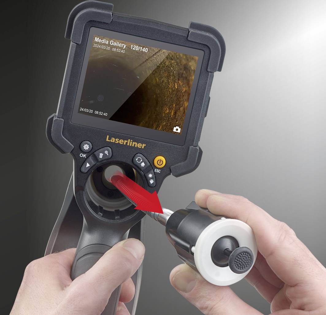 A person is holding an endoscope camera device with a Laserliner logo. The screen displays an image from the Media Gallery.