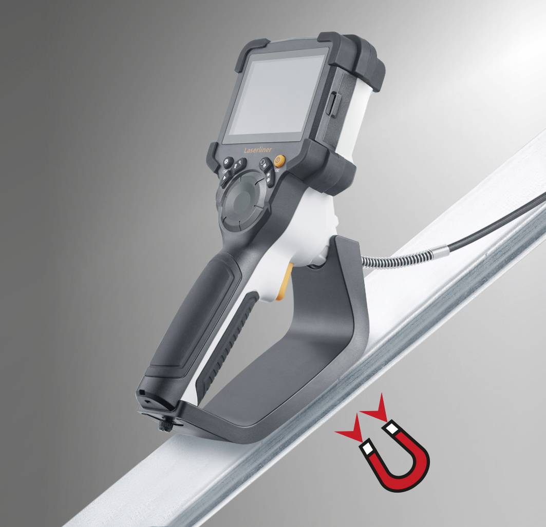 A measuring device with a display, mounted on a metal surface. It shows the application on metallic surfaces.