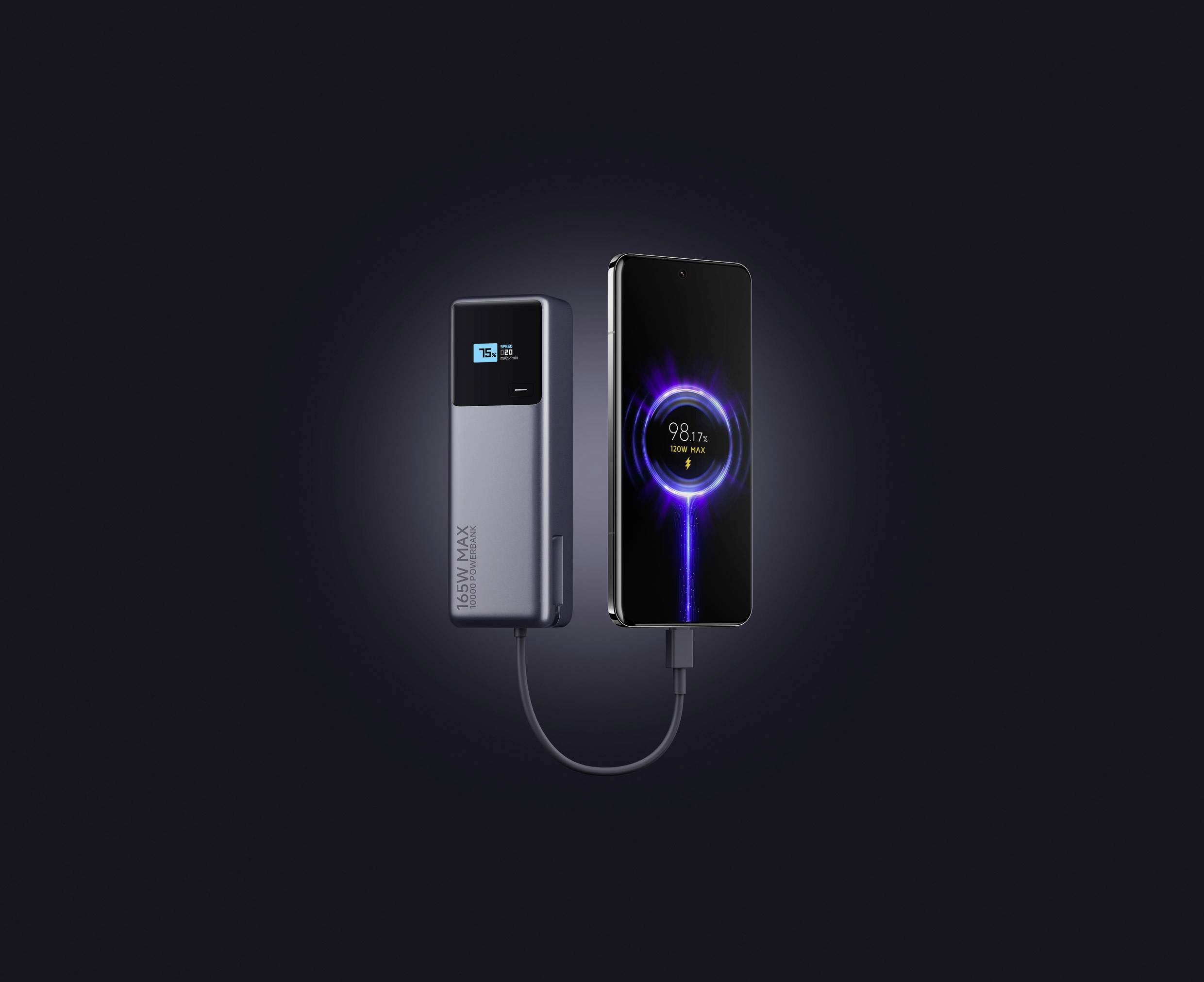 A mobile phone is connected to a power bank with a cable. A screen displays a charging indicator of 98%. Background is dark.