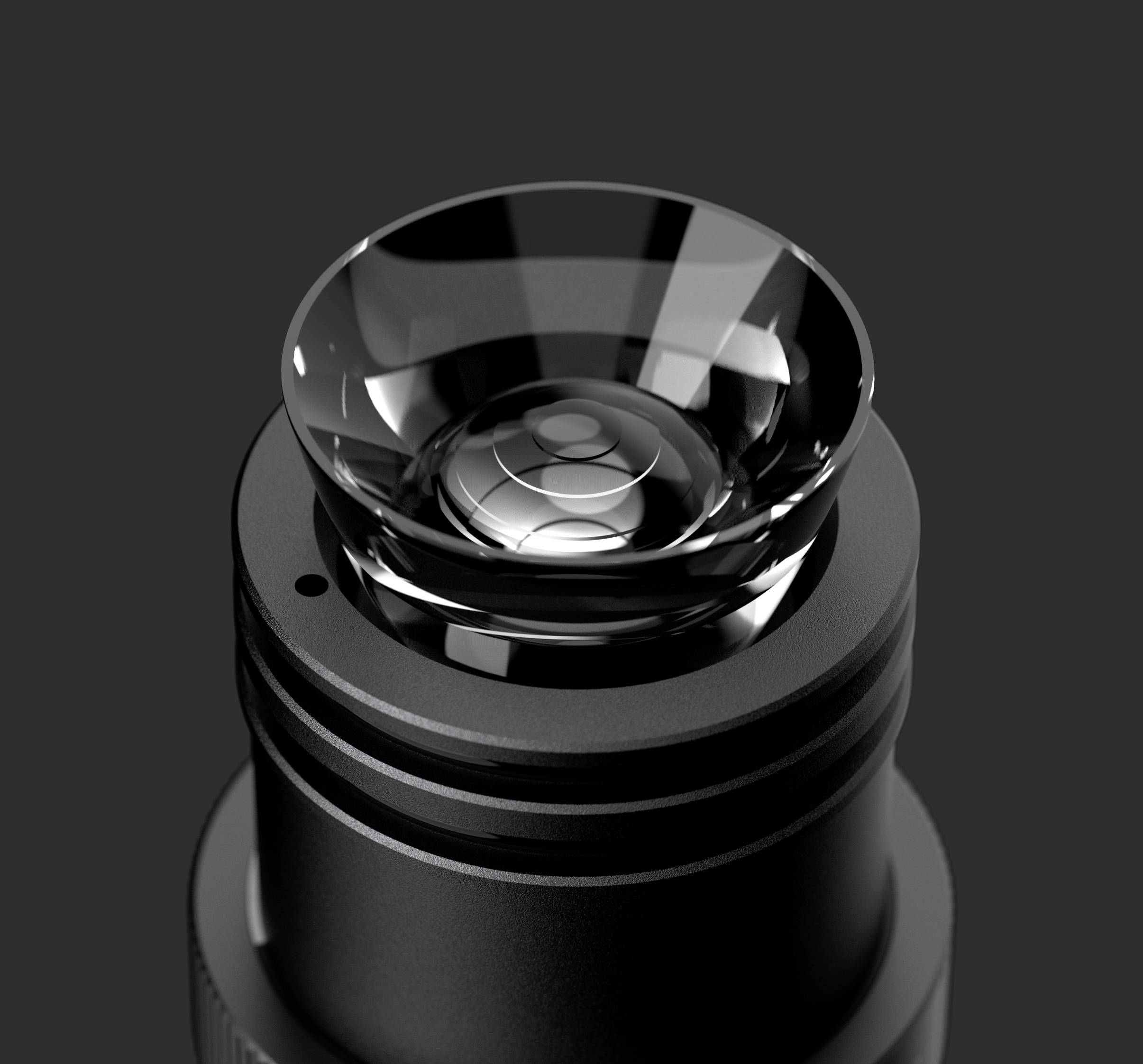 Close-up of a camera lens with a gleaming lens on a black background, revealing the lens's structure and design.