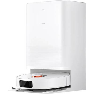 A white robotic vacuum cleaner docks at a charging station.
