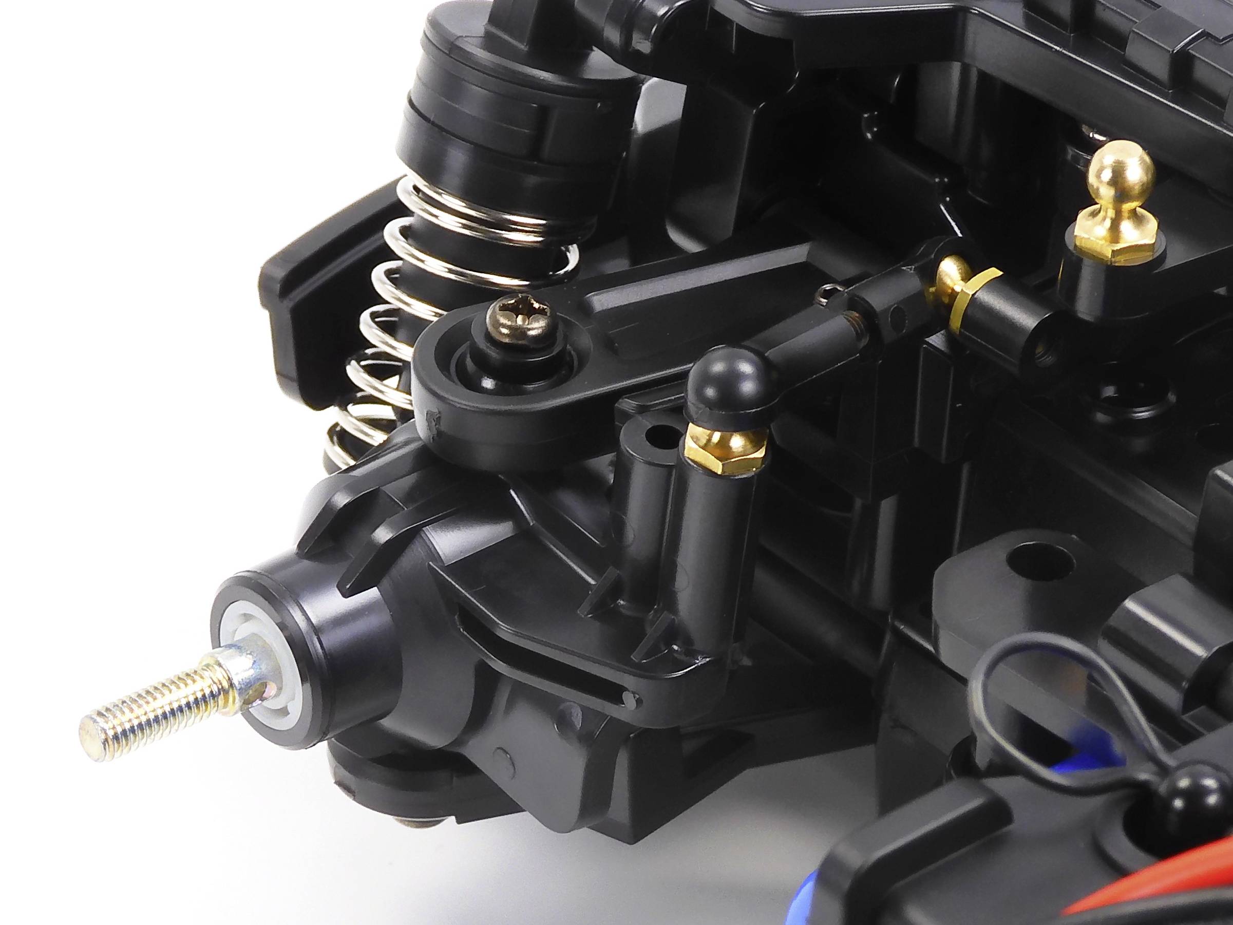 Close-up of a complex automotive component with springs and screw connections.