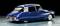 A blue, classic Citroën DS with glossy paintwork and a distinctive, streamlined body on a polished floor.