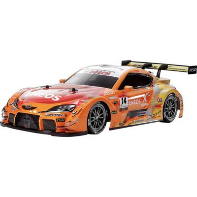 An orange and black racing car model with sponsor logos, aerodynamic design, and a large rear spoiler on a white background.